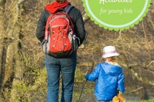 Image of parent and child walking in the woods for a post on Spring Break Activities