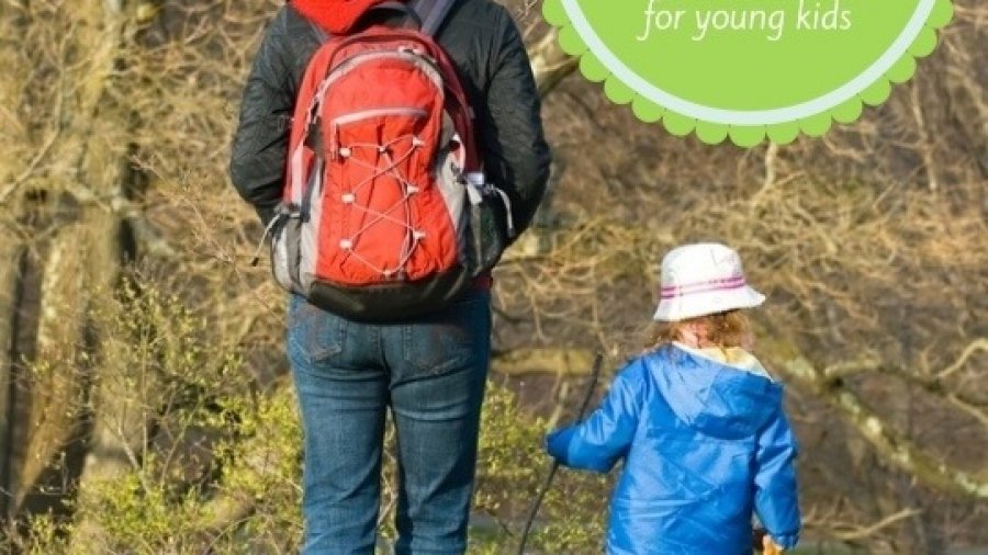 Image of parent and child walking in the woods for a post on Spring Break Activities