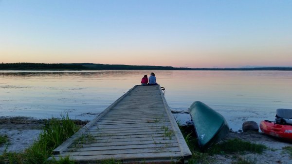 Sitting on the dock and watching the sun go down. Camping Culture, Photo credit Stacey Brotzel.